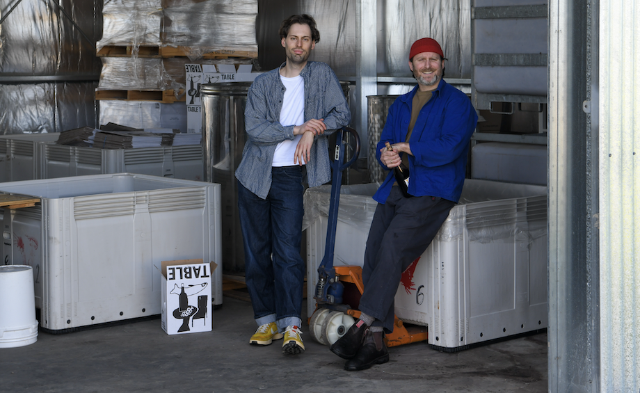 An image of Max and Jimmy standing in a shed looking to the camera.