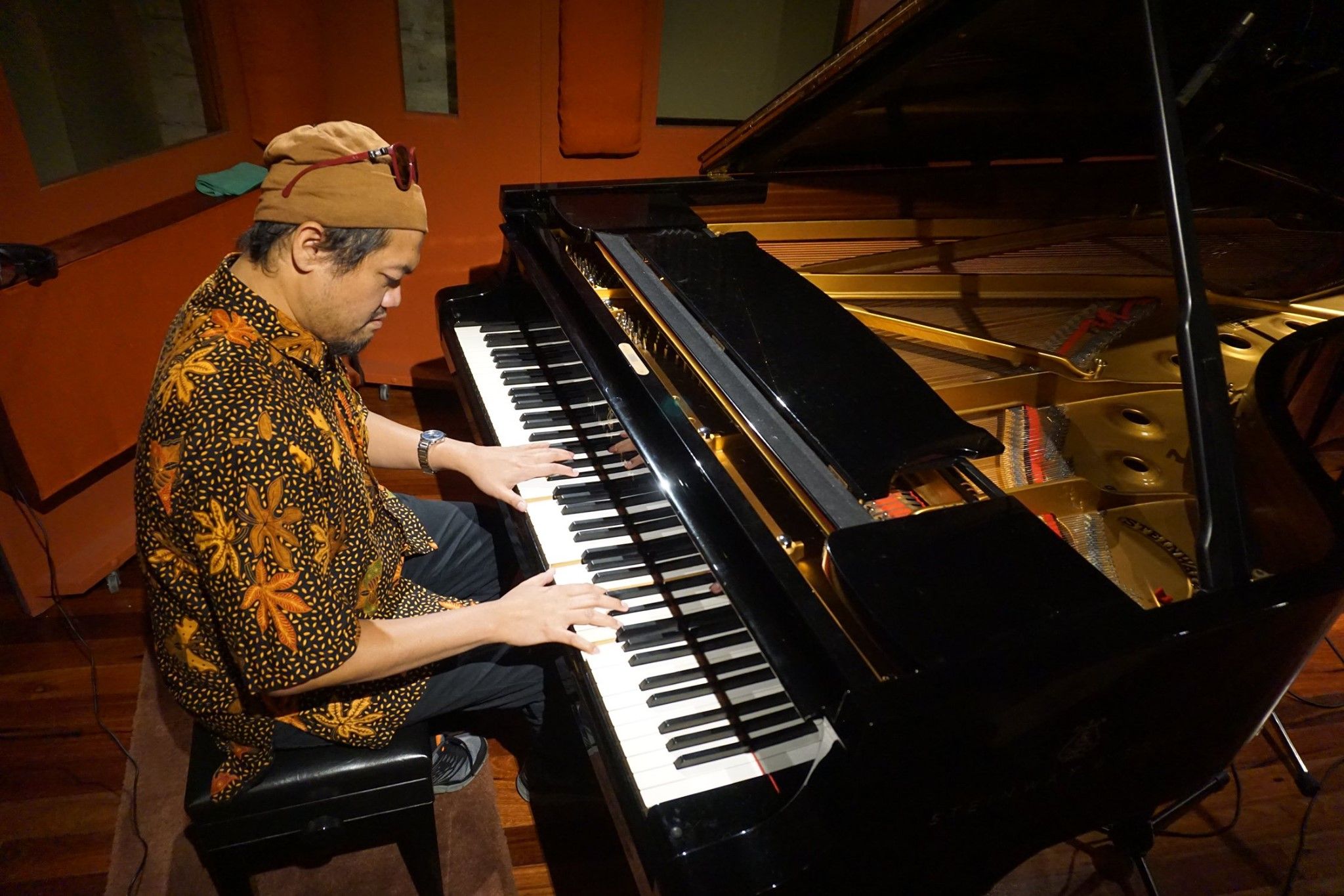ade ishs playing the piano