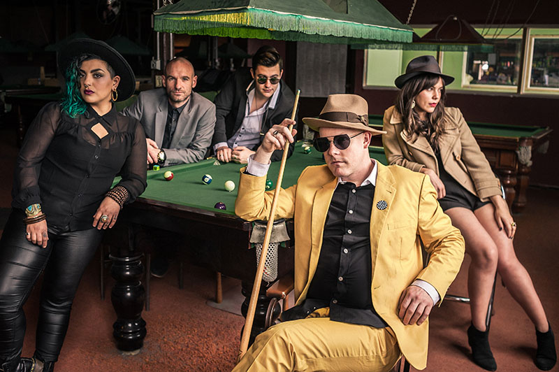 Lake Minnetonka band members around a pool table
